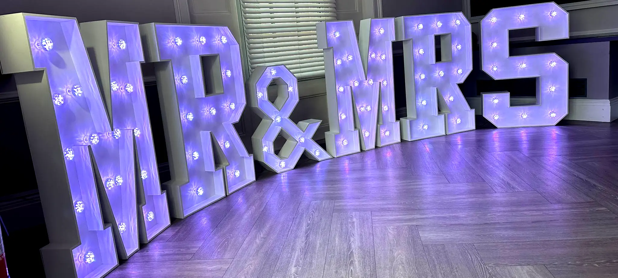 banner for mr and misses led light up letters hire for wedding